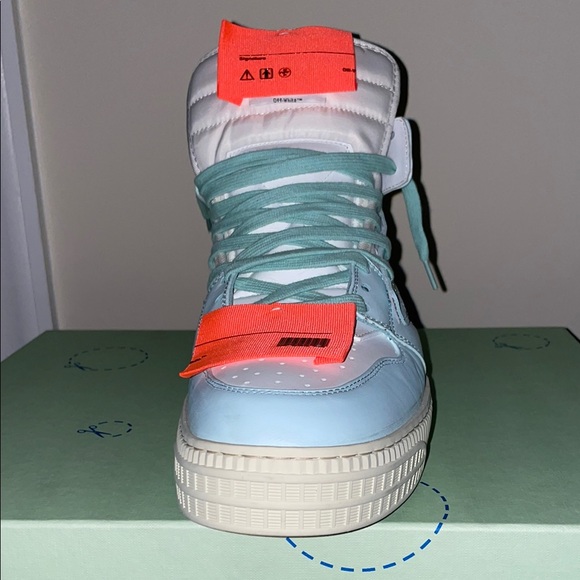 Off-White Sneakers with Orange and Light Blue Accents